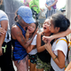 Relatives mourn a slain alleged drug dealer in Manila on Sept. 11, 2016.